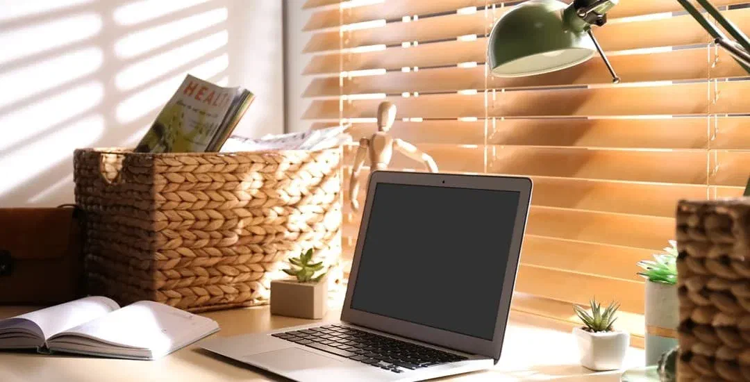Dealing with office glare: This laptop screen is dark because of sunlight from a window.